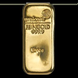 1 Kilo Gold Bar Umicore – sztabka złota prezentowana na tle metali szlachetnych